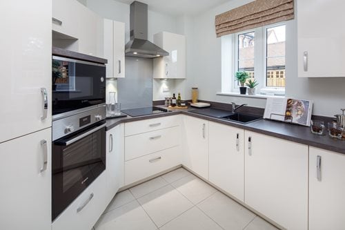 a kitchen with white cabinets