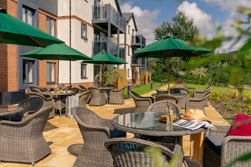a patio with tables and chairs
