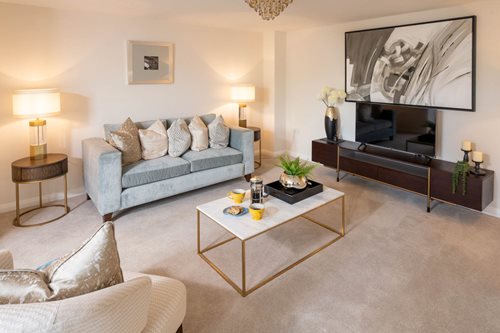 a living room with a tv and couches