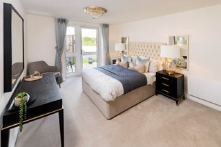 a bedroom with a bed and a table