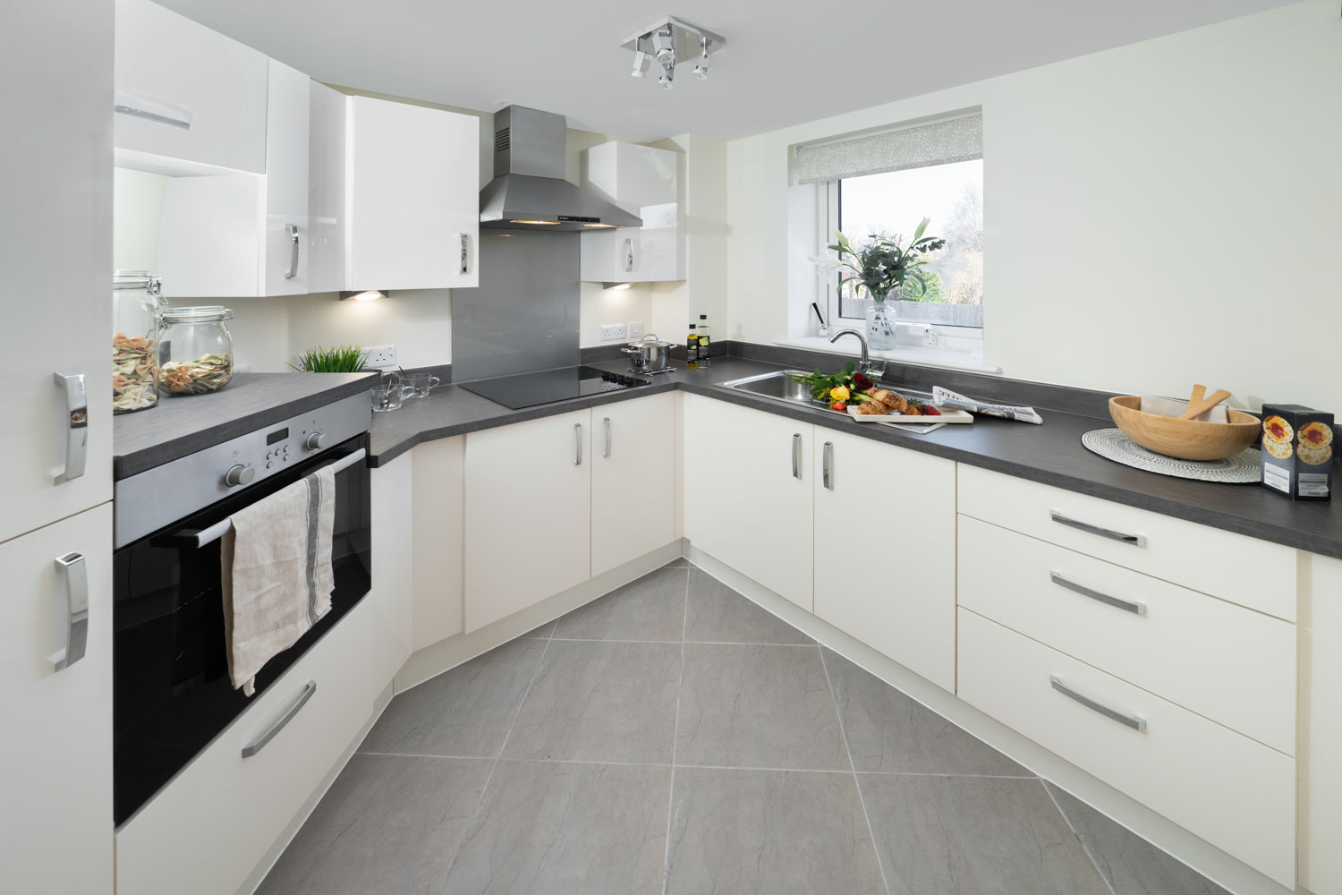 a kitchen with white cabinets