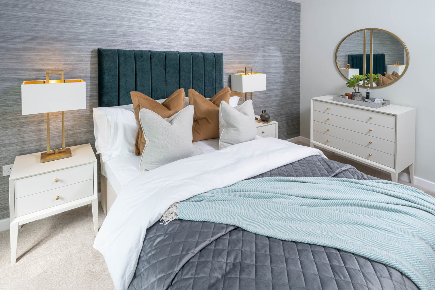 a bed with a mirror on the wall