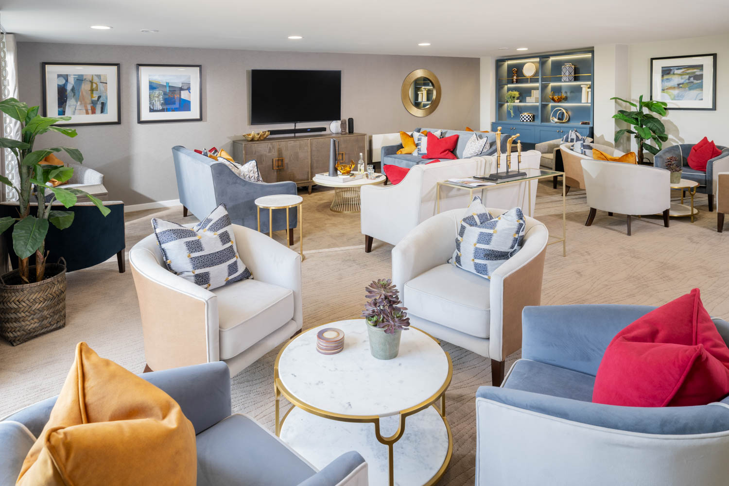 a living room with a large tv and couches