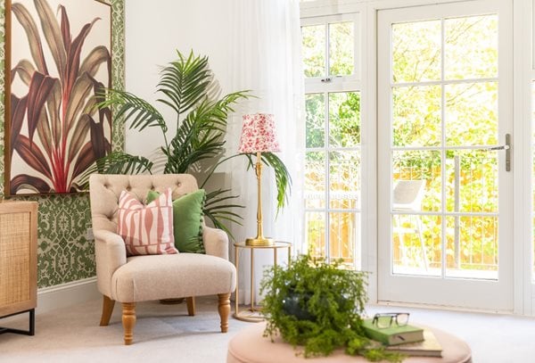 a living room with a table and chairs