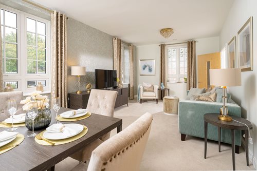 a large living room with a large dining table and chairs