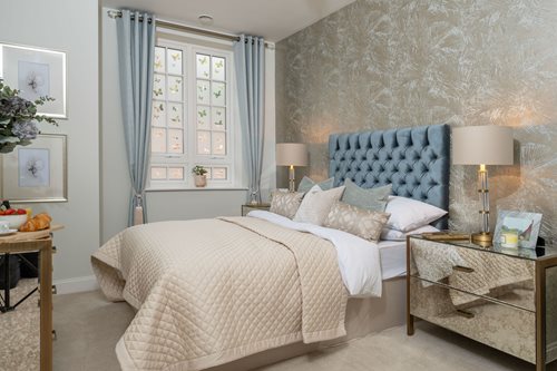 a bedroom with a bed and a table