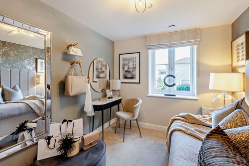 a bedroom with a bed and a mirror
