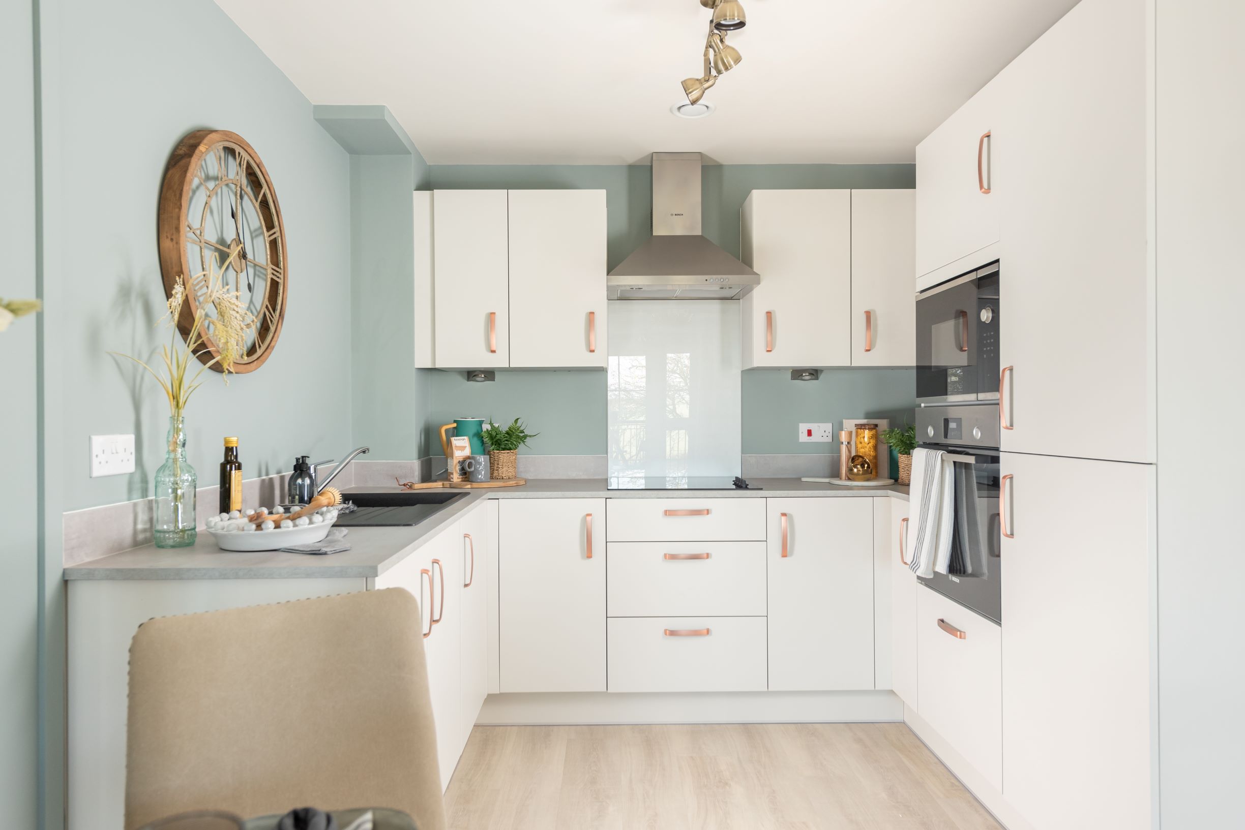 a kitchen with white cabinets