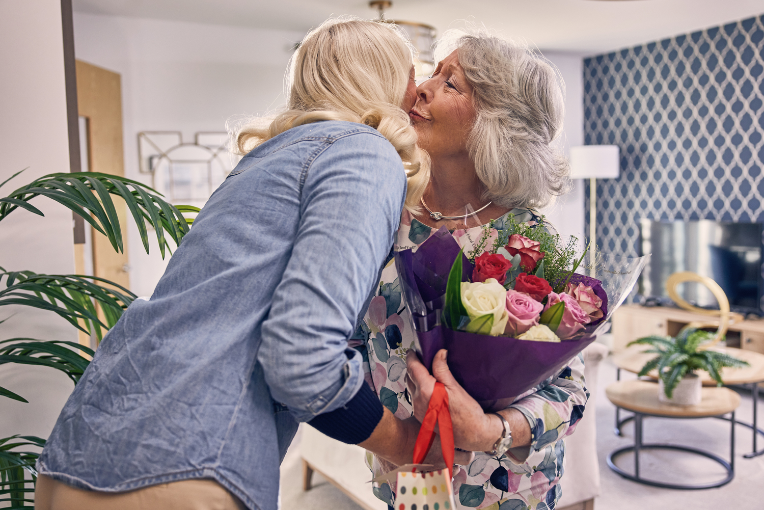 a woman holding a bouquet of flowers