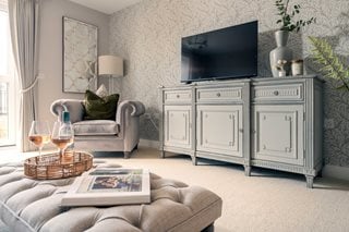 a living room with a tv and furniture