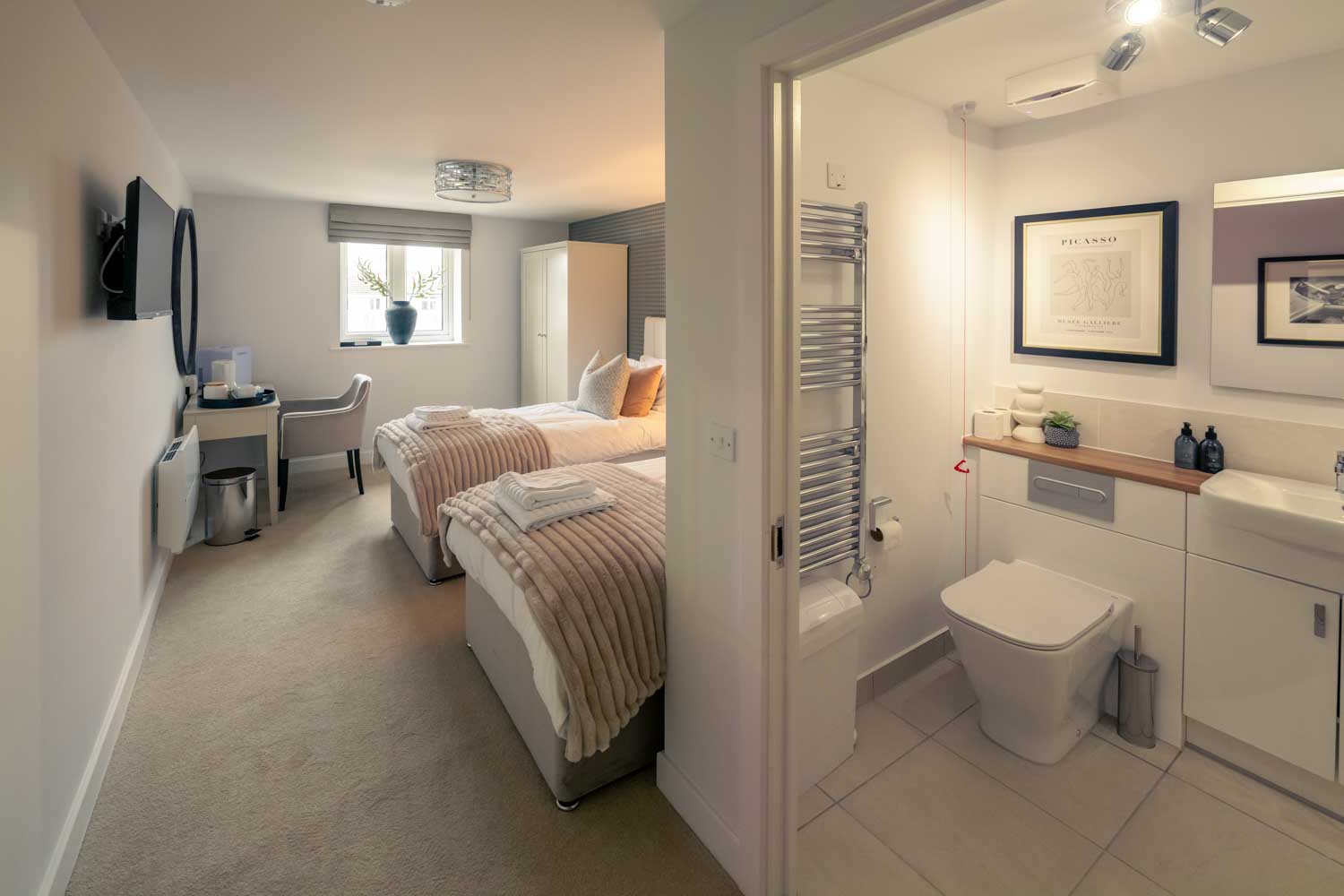 a bathroom with a bed and a sink