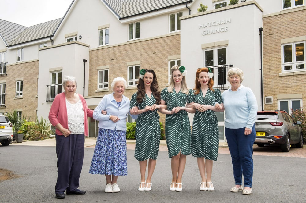 a group of women posing for a photo