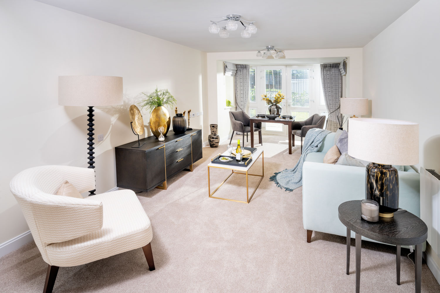 a living room with white furniture