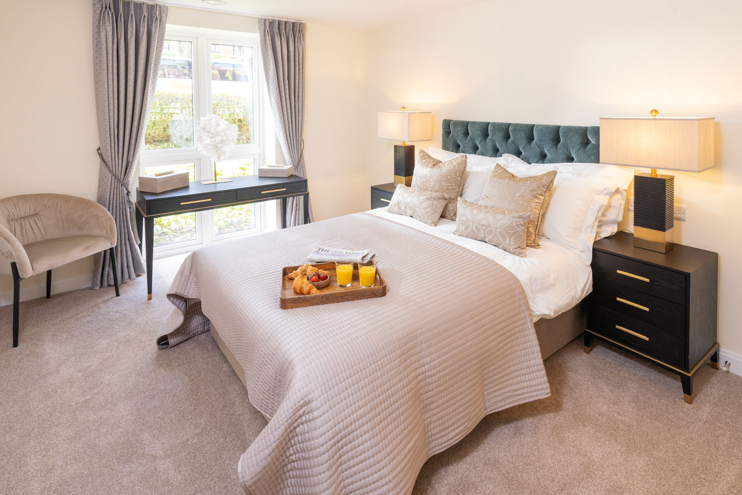 a bedroom with a bed and a table