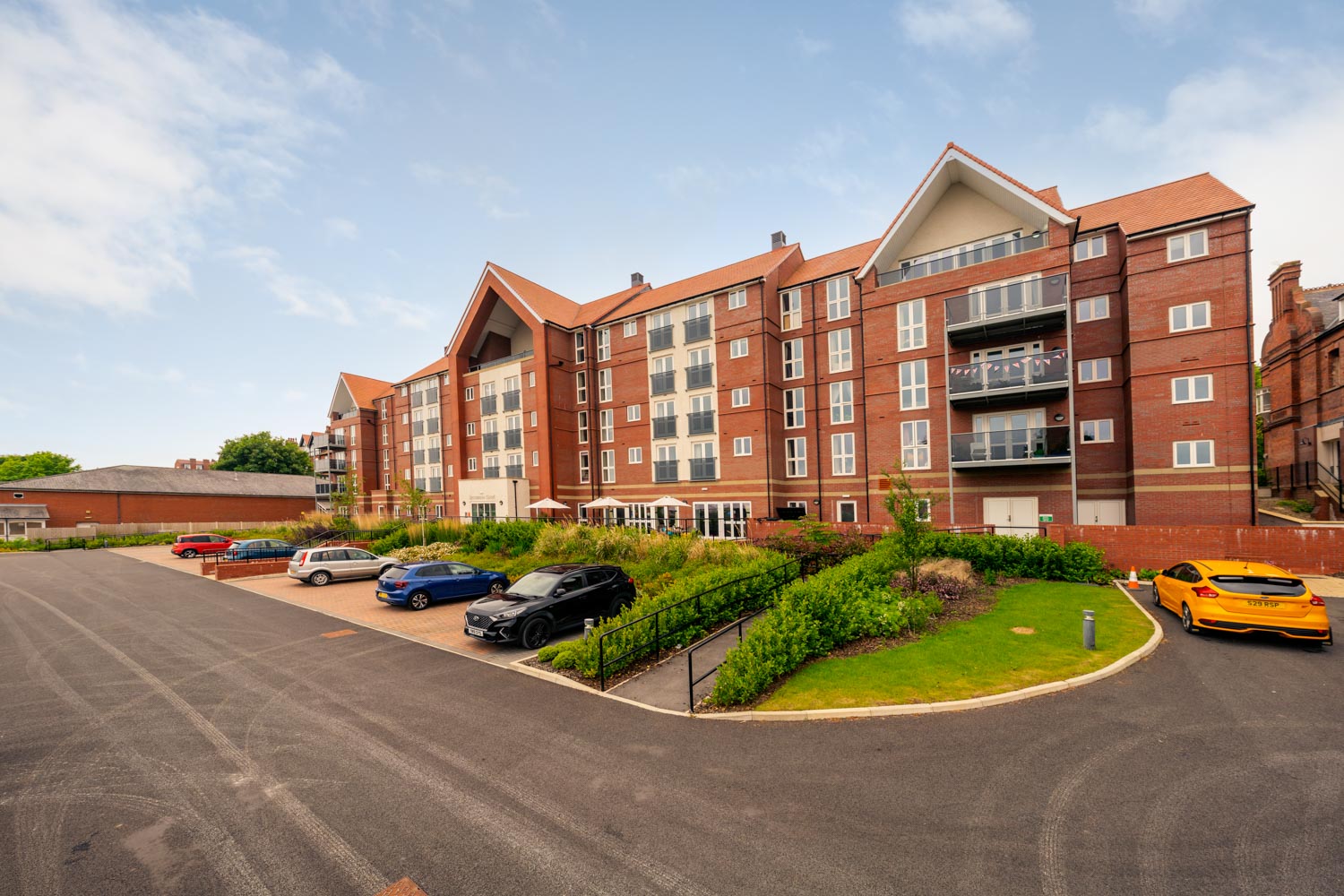 a building with cars parked in front