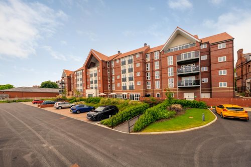 a building with cars parked in front