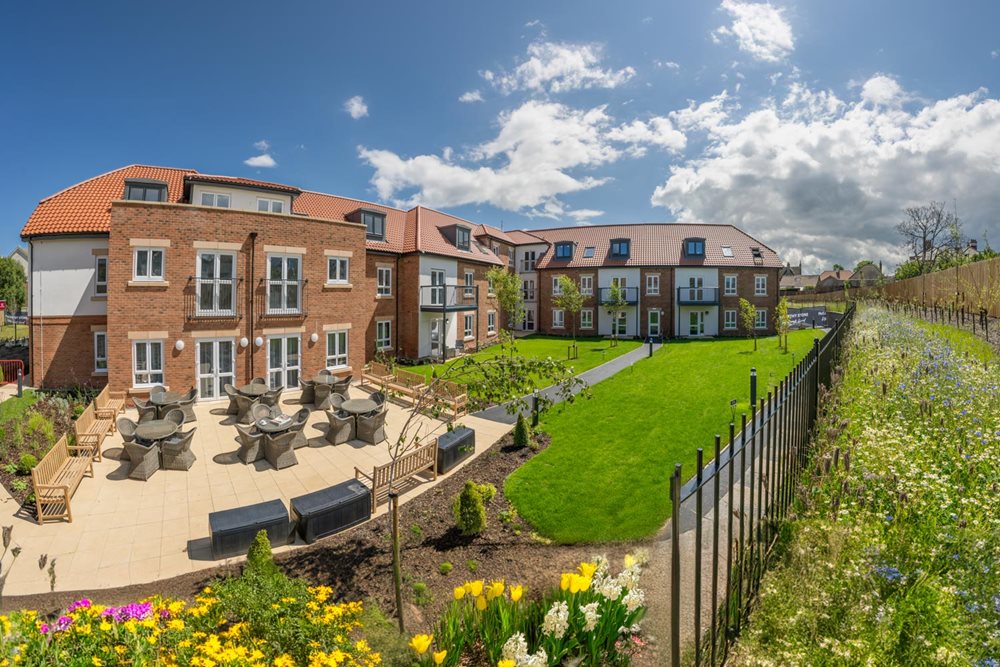a garden in front of a building