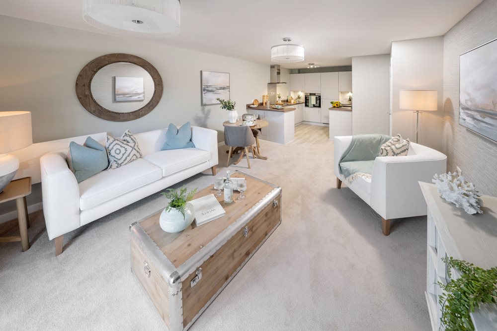 a living room with white couches