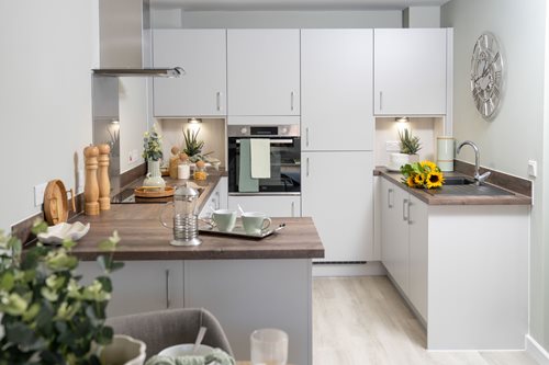 a kitchen with white cabinets