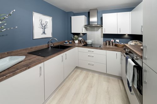 a kitchen with white cabinets