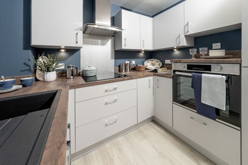 a kitchen with white cabinets