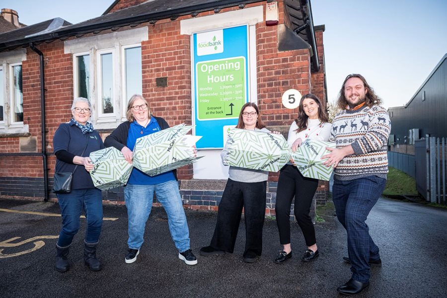 a group of people holding bags