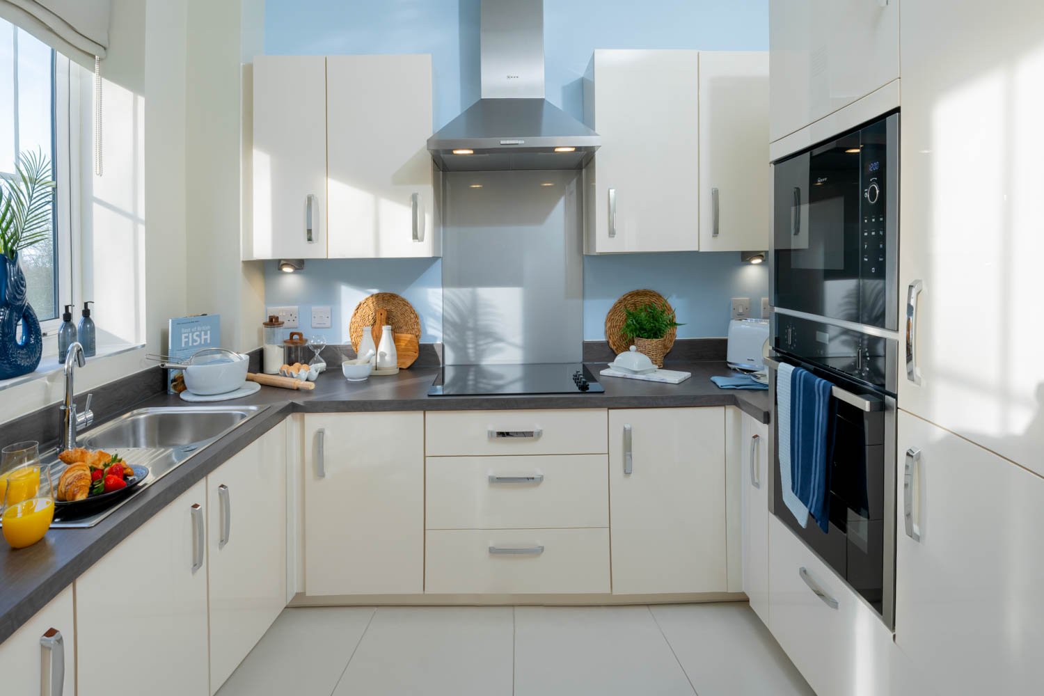 a kitchen with white cabinets