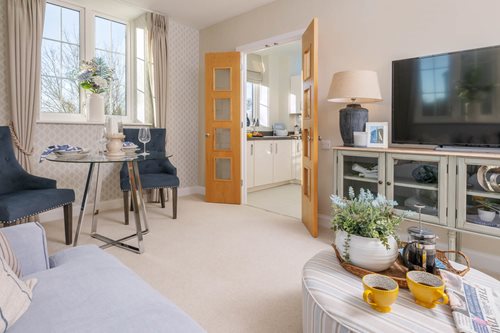 a living room with a tv and a table