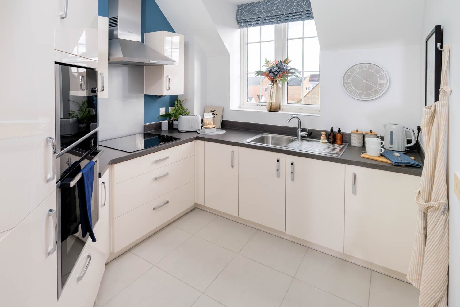 a kitchen with white cabinets