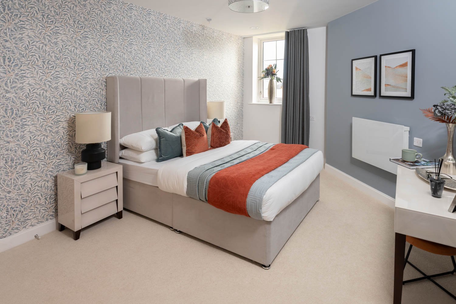 a bedroom with a bed and a desk