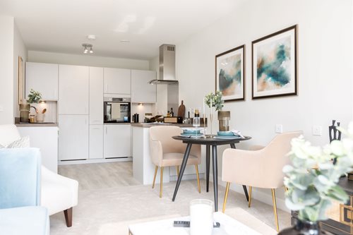 a kitchen with white furniture