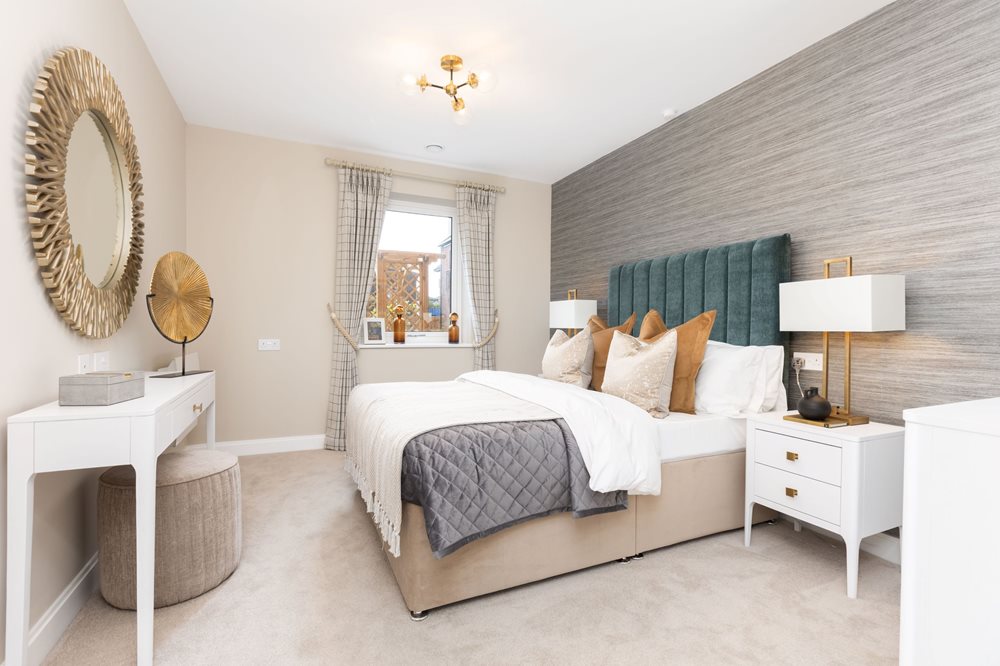 a bedroom with a bed and a mirror