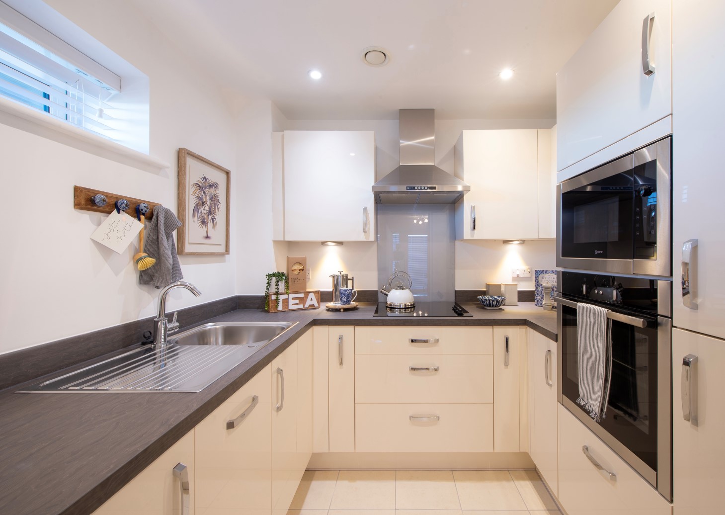 a kitchen with white cabinets