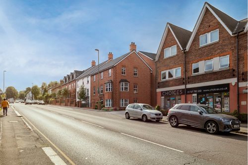 a street with cars parked along it