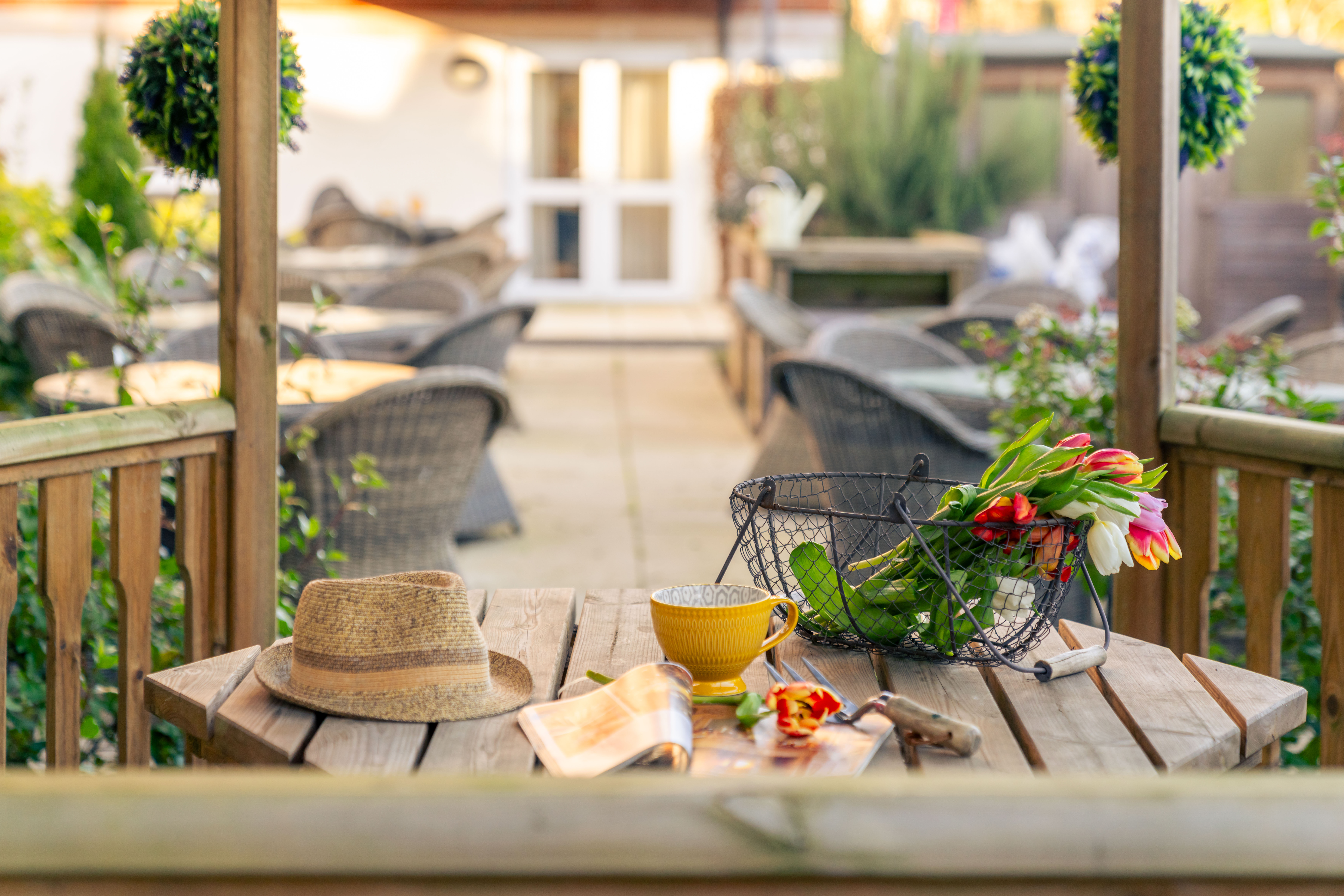 a hat and a basket on a table