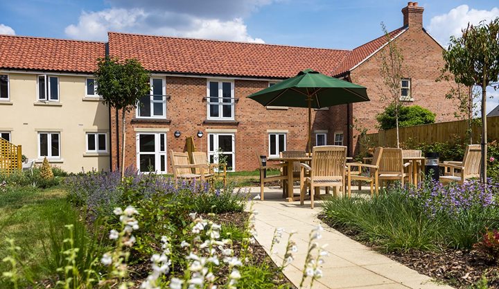 a patio with chairs and tables