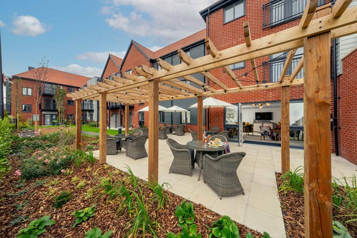 a patio with a table and chairs