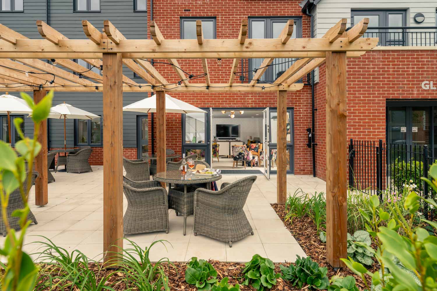 a patio with tables and chairs