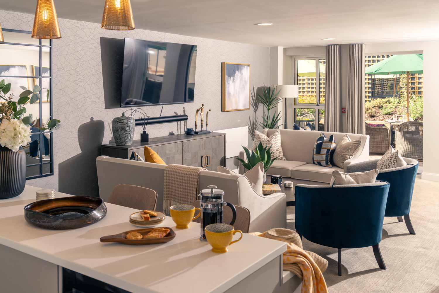 a living room with a table and chairs