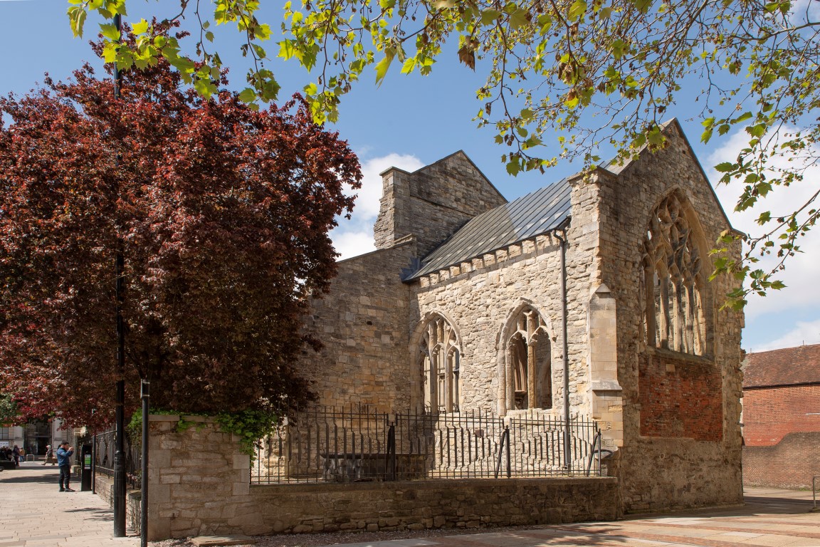 a brick building with a fence around it