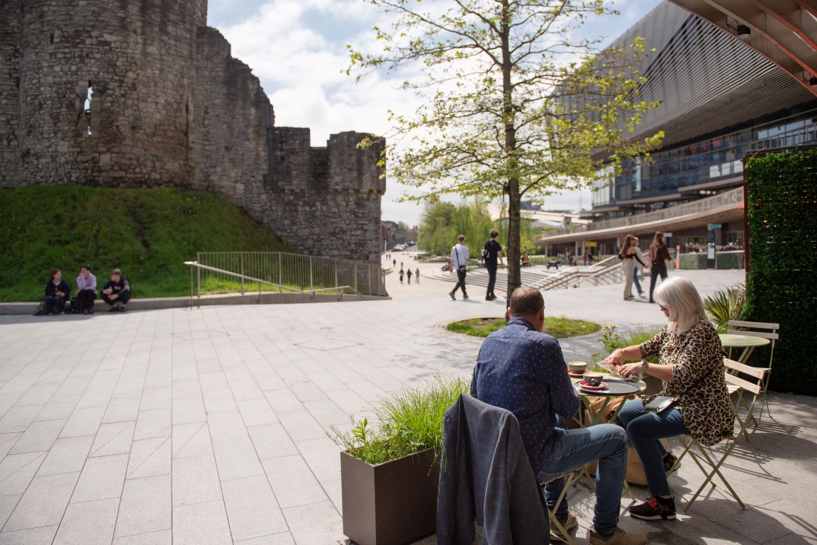 people sitting outside on chairs