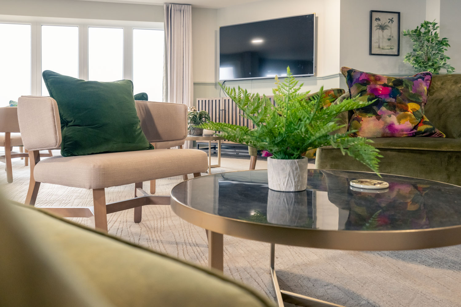 a living room with a table and chairs