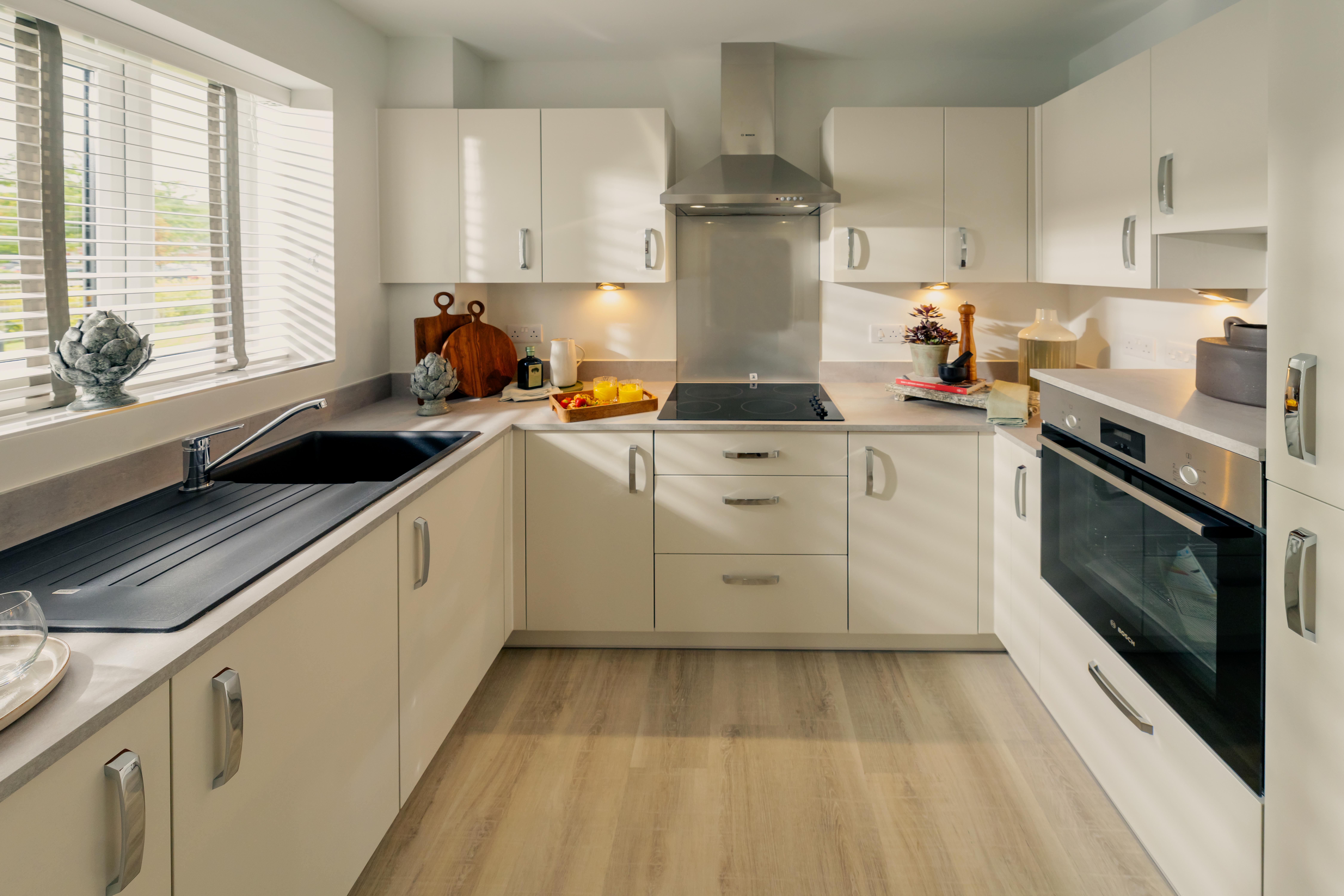 a kitchen with white cabinets