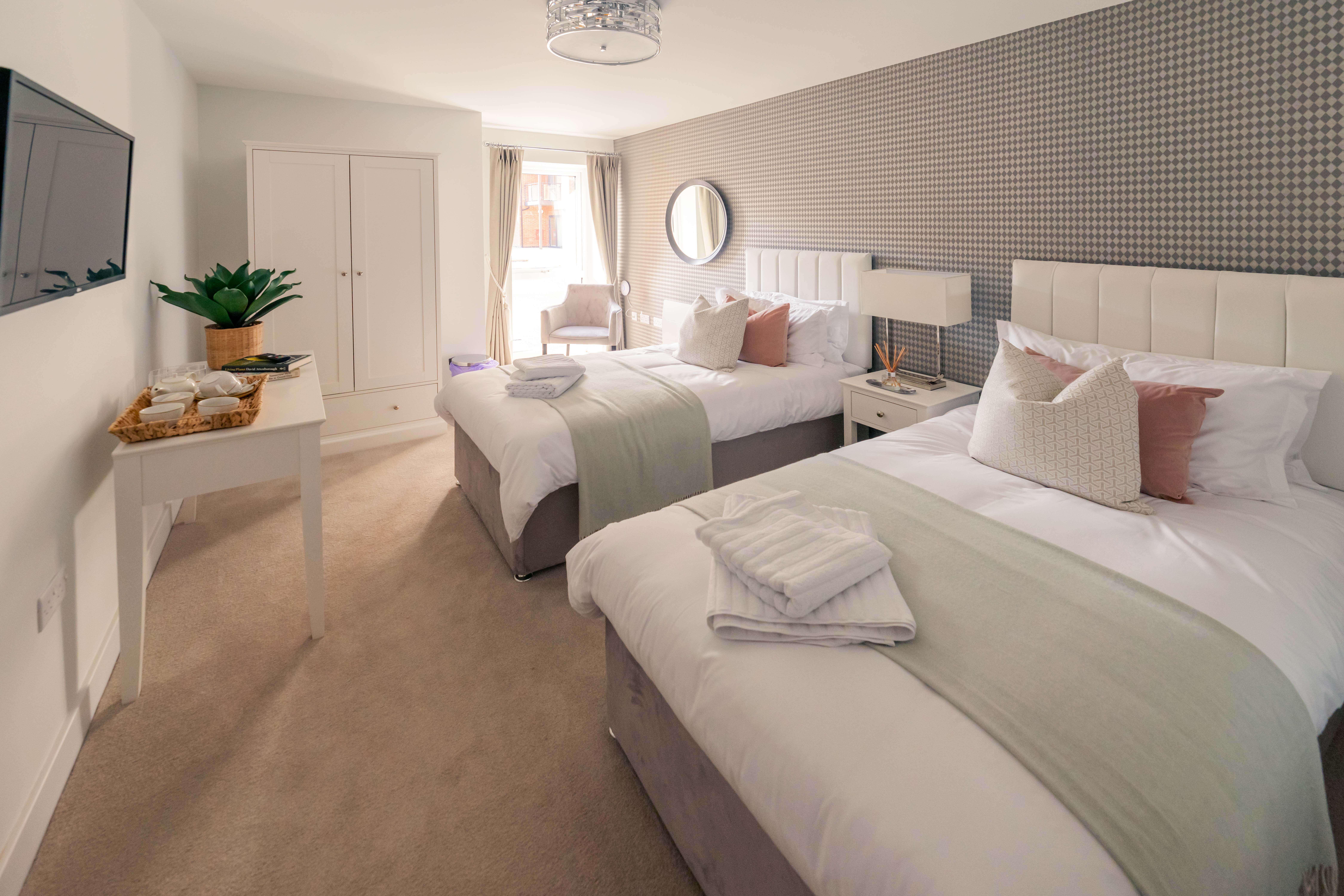 a couple of beds in a hotel room