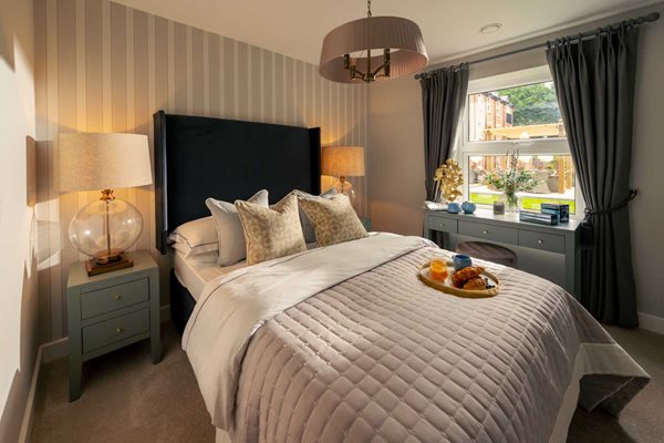 a bed with a tray of food