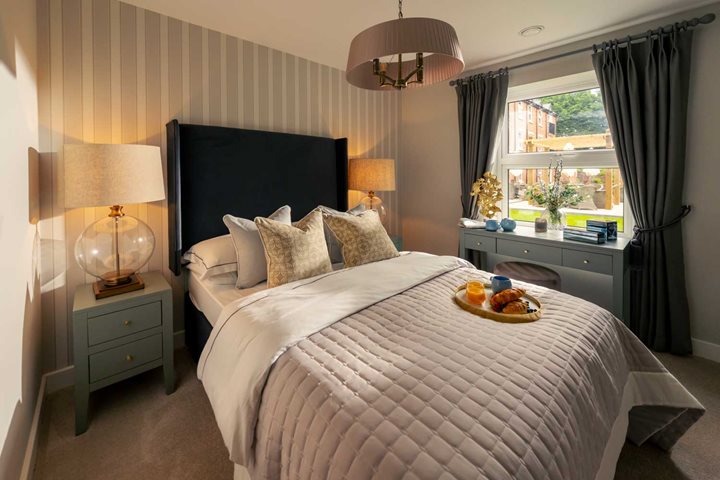 a bed with a tray of food