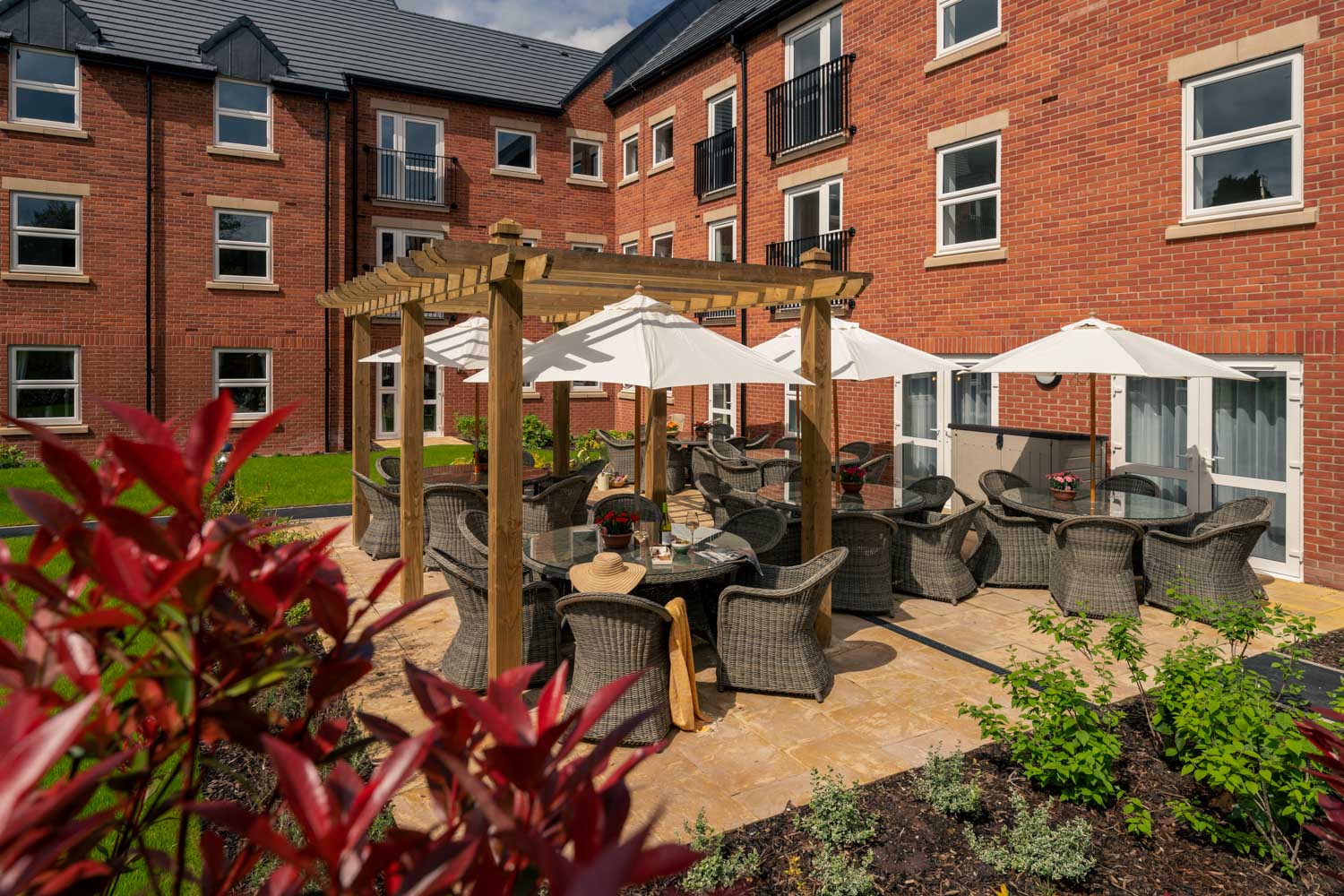 a patio with tables and chairs