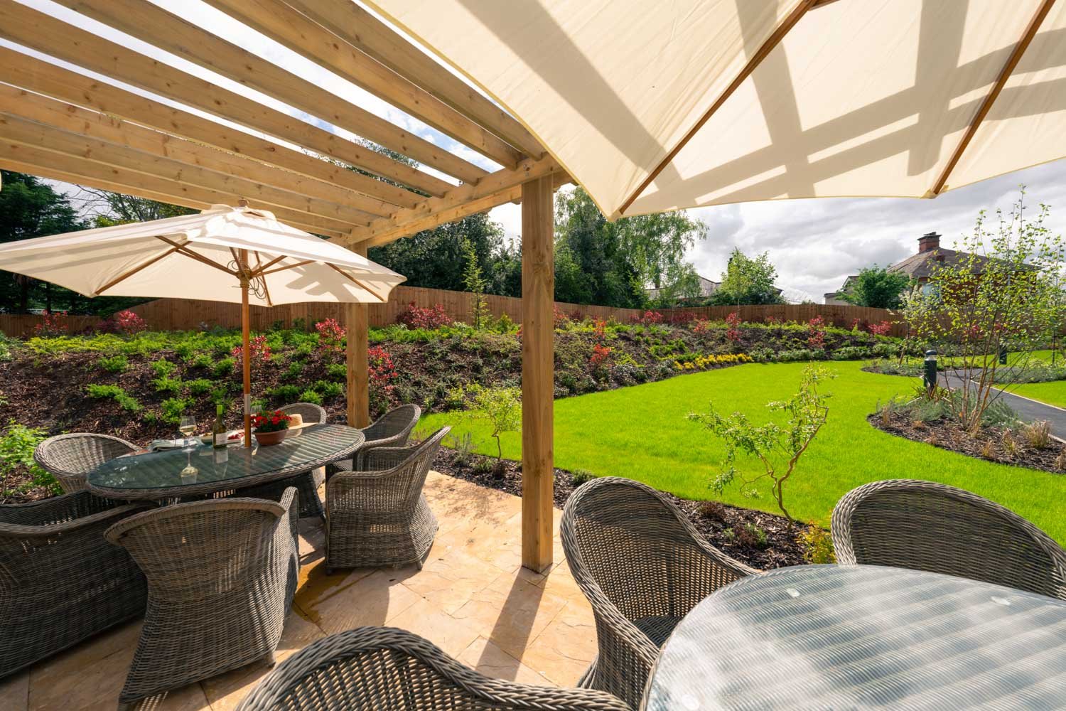 a patio with a table and chairs