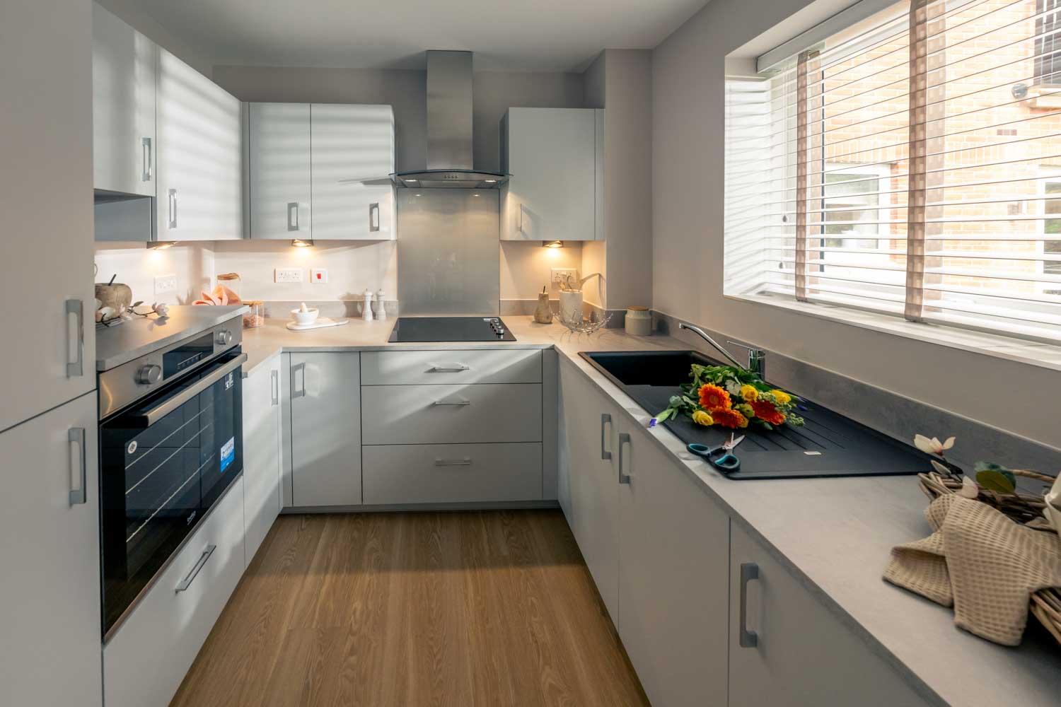 a kitchen with white cabinets