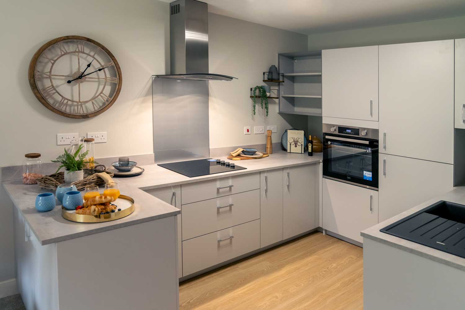 a kitchen with a clock